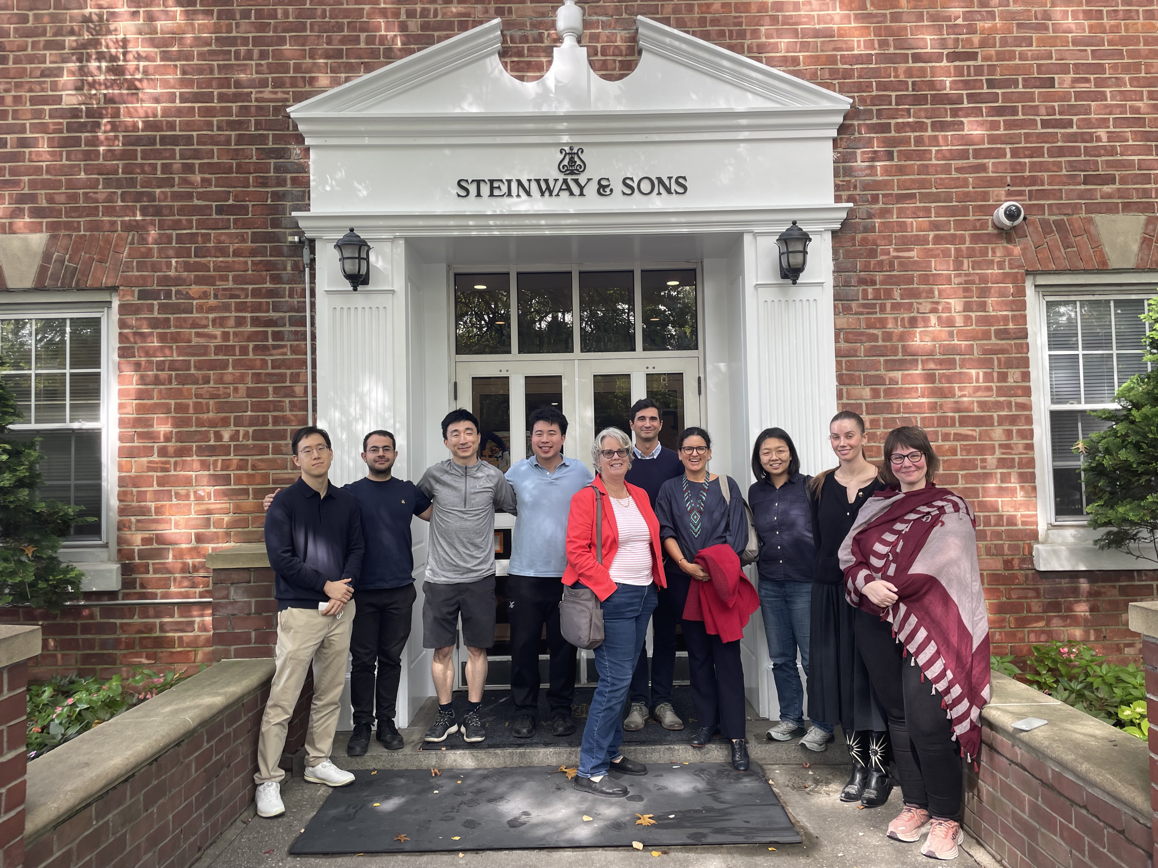Study tour group outside Steinway & Sons piano in Astoria, NY.
