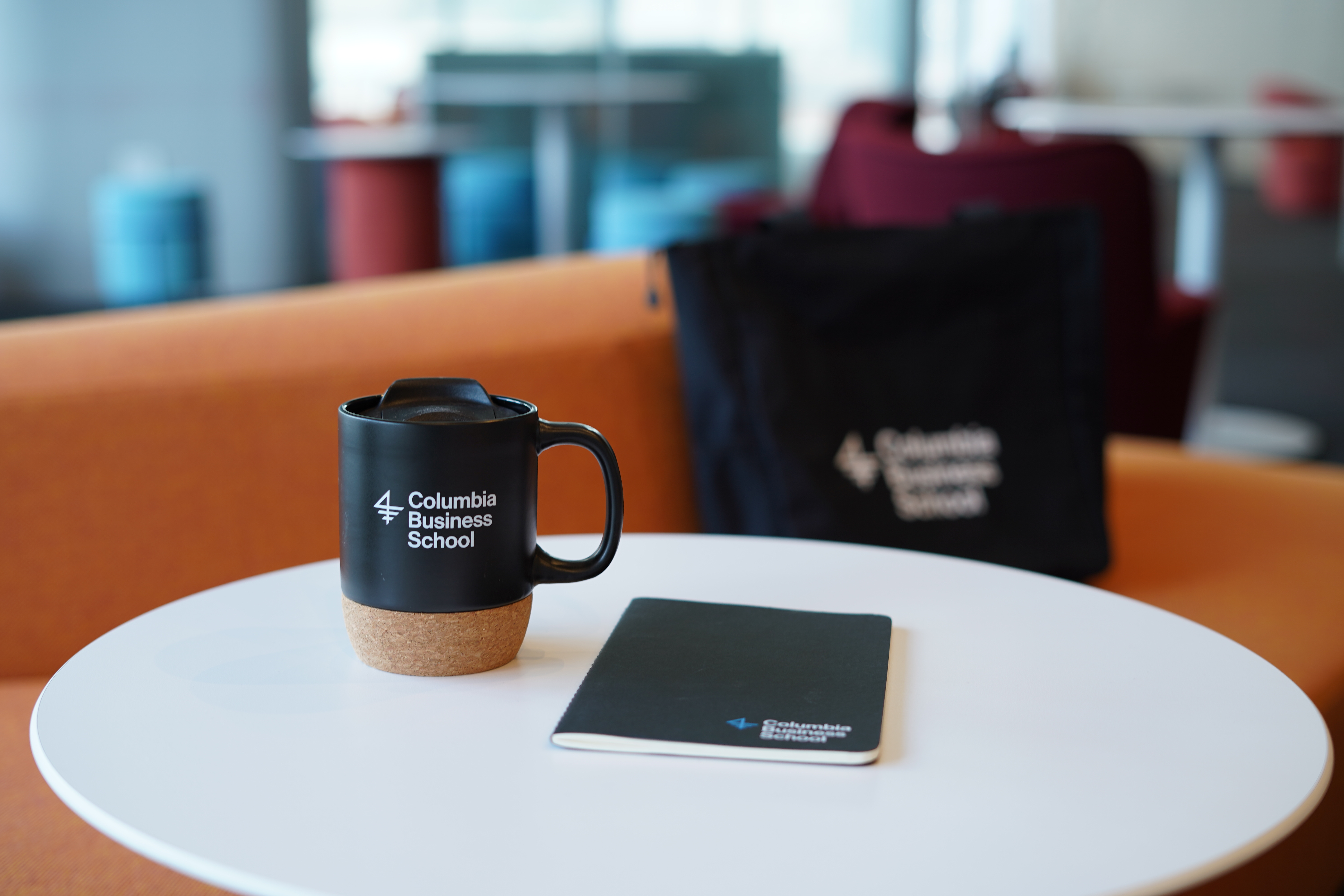 CBS branded mug, notebook, and bag