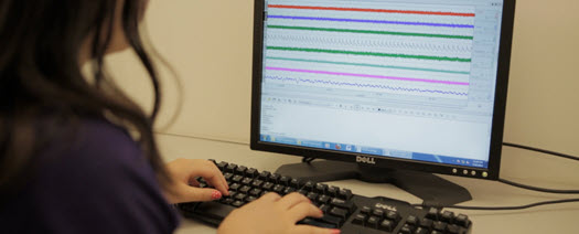 Hands typing on a keyboard