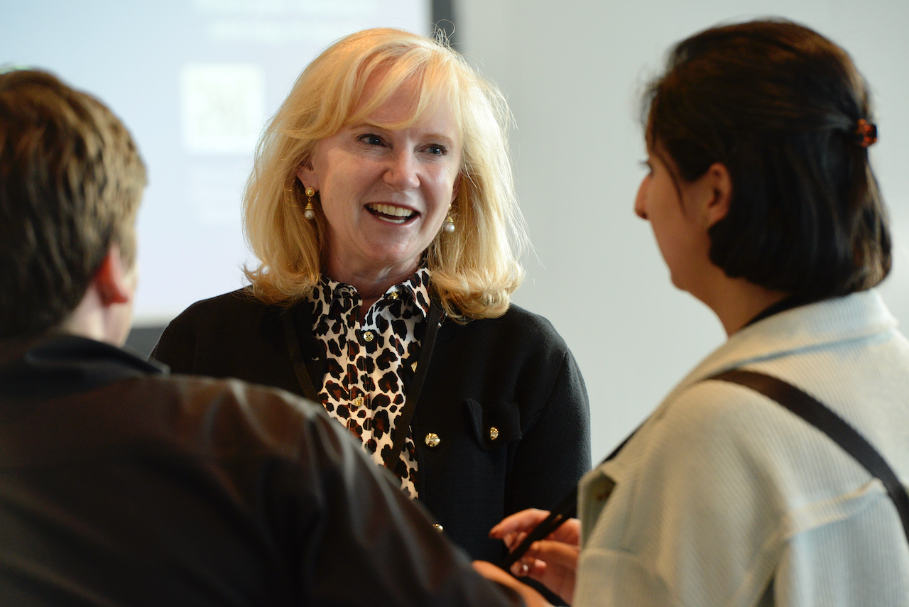 Ciara Burnham ’93 (Pilobolus Board Mentor) talking to her student team Esha Sondhi '25 and Will Rose '25