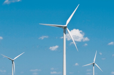 Wind turbines against blue sky