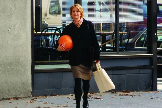 Meg Ryan carrying a pumpkin 