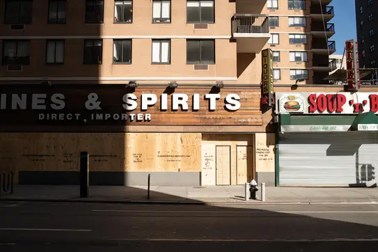 A row of boarded up stores in Manhattan