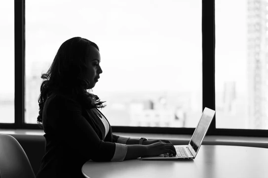 Woman types on her computer