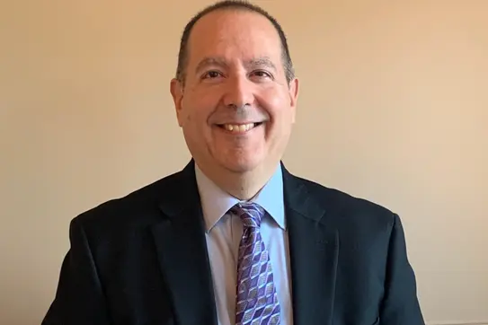 Author David M. Schizer smiles