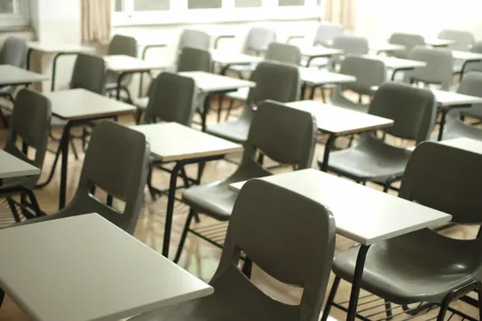 classroom with rows of desks and chairs
