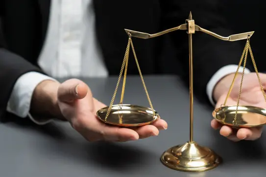 hands weighing a scale