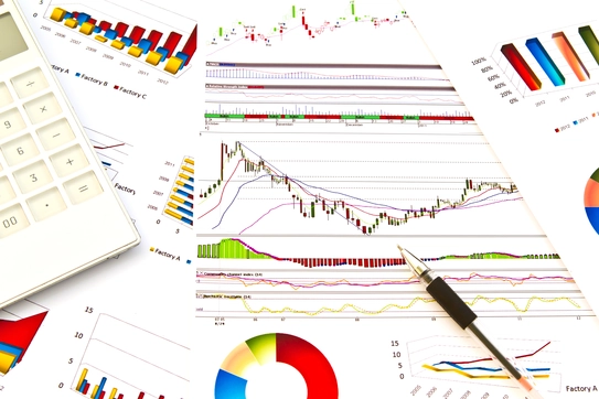 Paperwork with colorful data charts and graphs Image