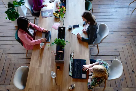Woman in business image of women working at a desk