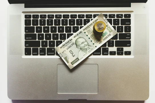 Money on a computer keyboard