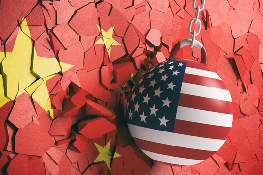American flag wrecking ball hitting a Chinese wall flag