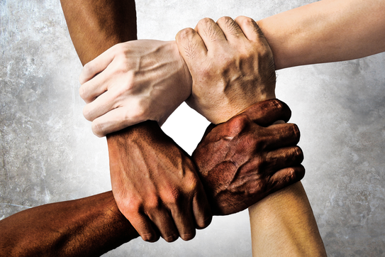 People holding hands. A symbol and concept of unity, teamwork and support.