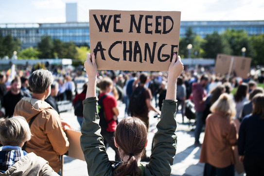 A protestor holding a placard