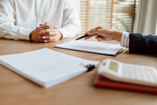 A person signing a contract