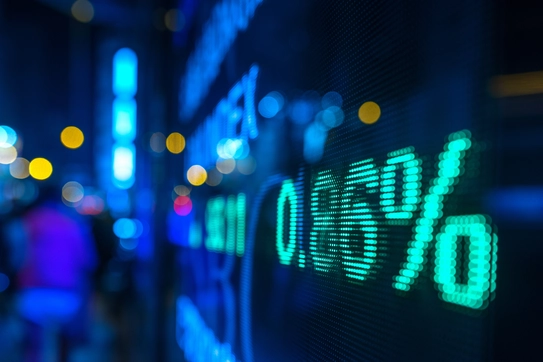A stock market chart and a city street