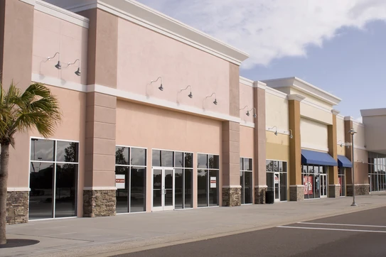 A strip mall of several retail stores.