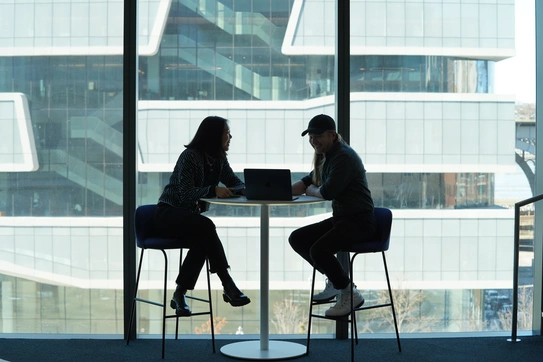 Students collaborating at a high top table