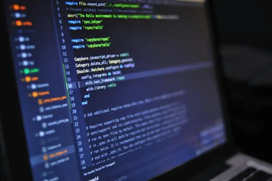 Extreme closeup of a computer screen with lines of code on it