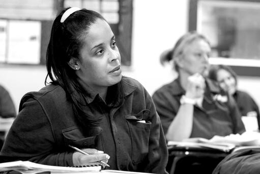 Student takes notes in class.