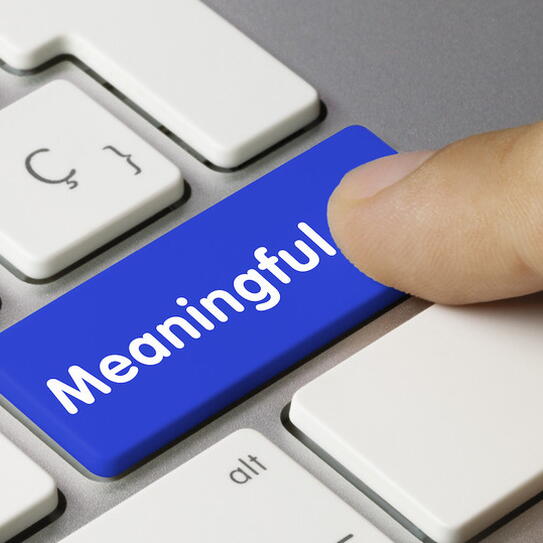 Blue keyboard button with the word "meaningful"